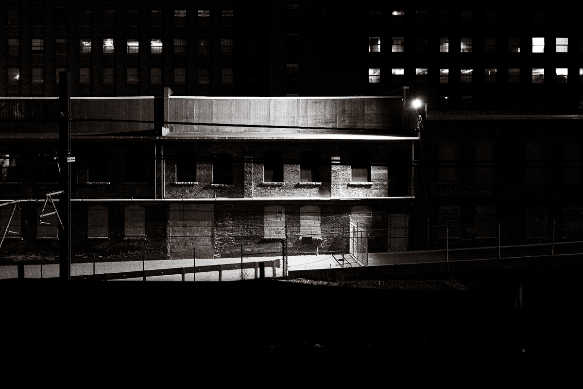 Black and White photo of a building at night