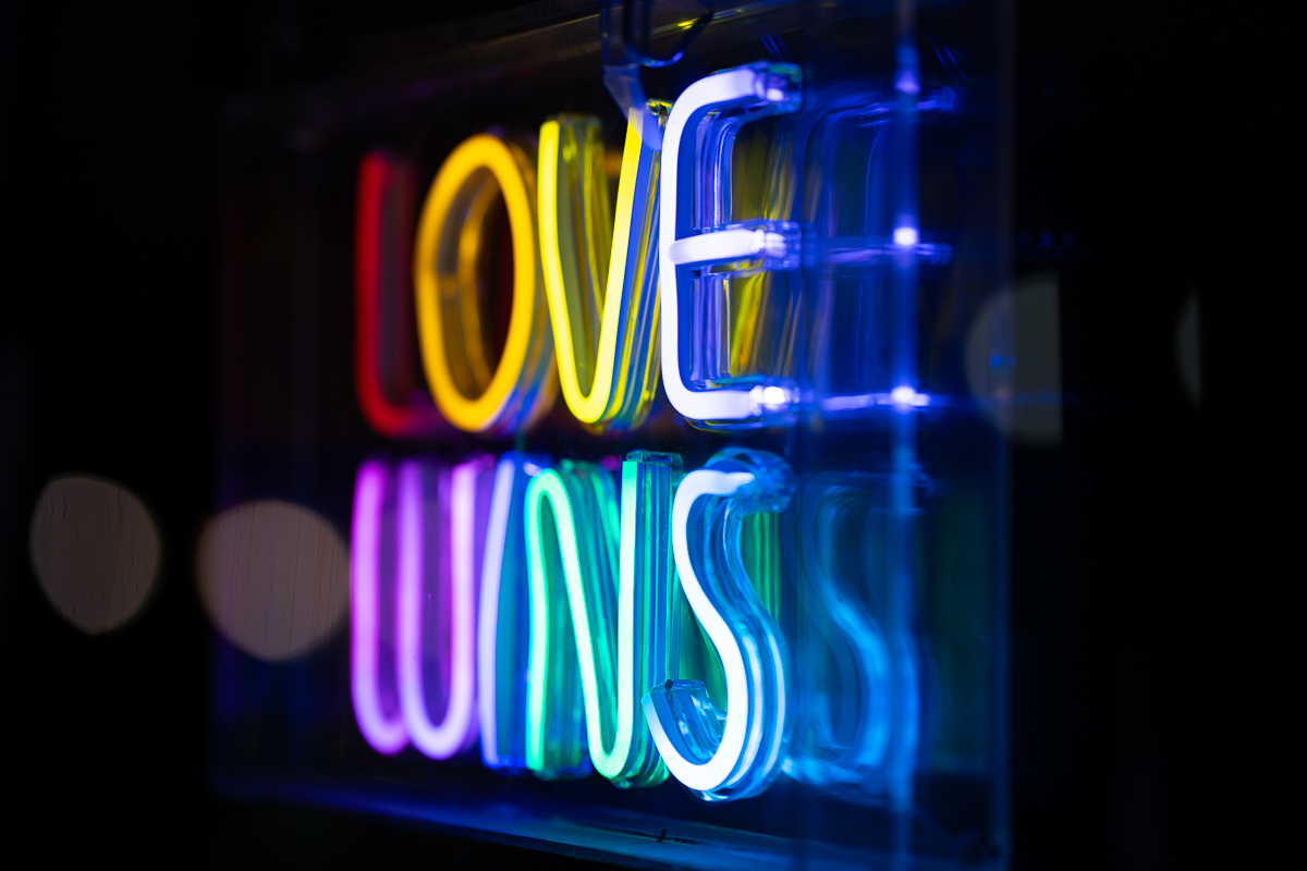 Photo of a neon sign that says "Love Wins"